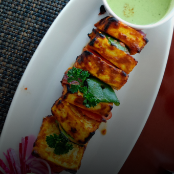 Paneer Tikka Chunks of fresh cottage cheese, marinated, skewered and grilled in traditional oven